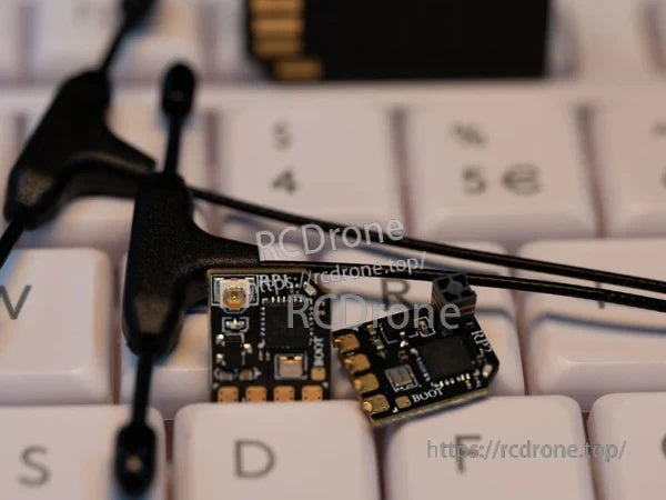 RadioMaster UFL 2.4GHz T antenna connected to an ELRS receiver UFL port, close-up on the connector