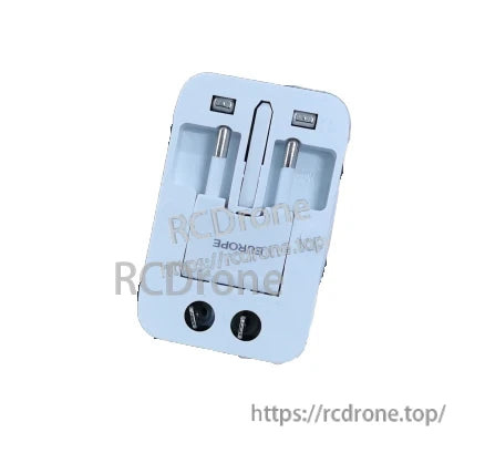 Angled back view showing adapter plug mechanism, EU pins, dual USB ports and website watermark