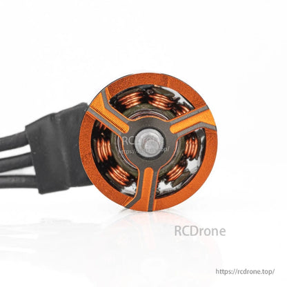 VCI SPARK 0703 brushless motor top view close-up showing stator coils and orange spokes