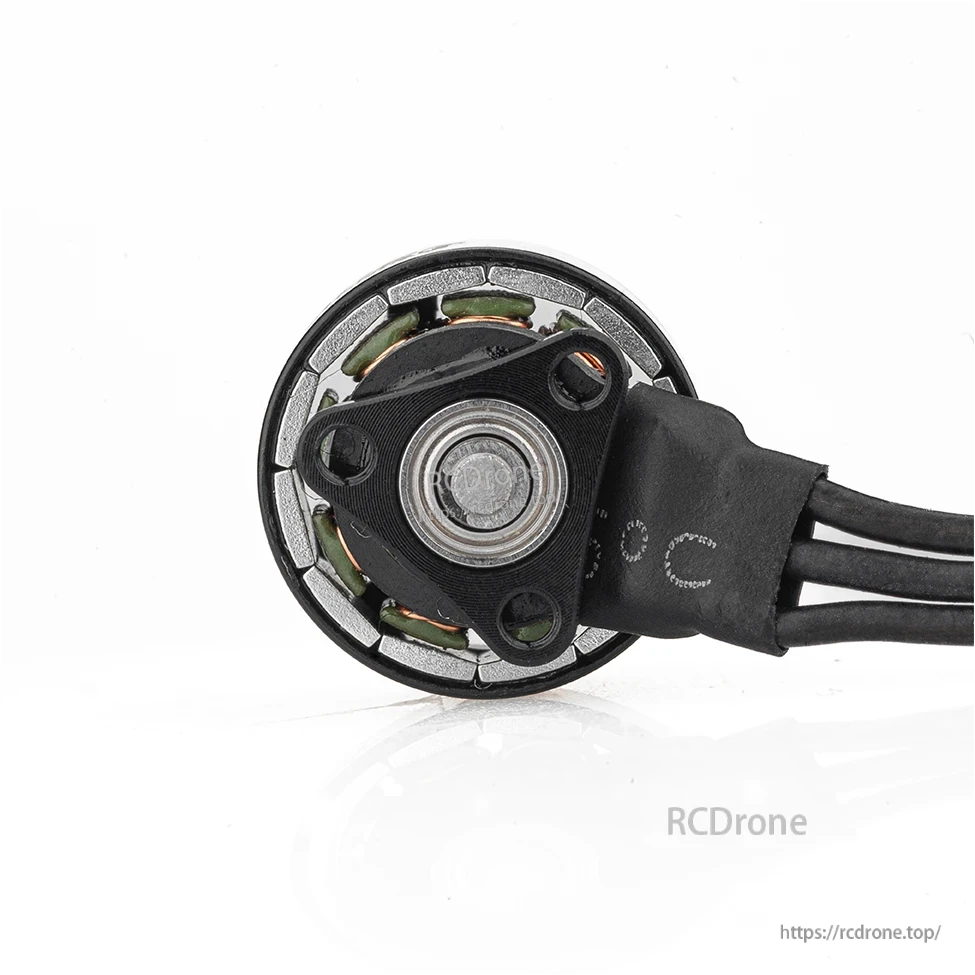 Bottom view of motor base with mounting plate and center bearing, wire leads exiting side