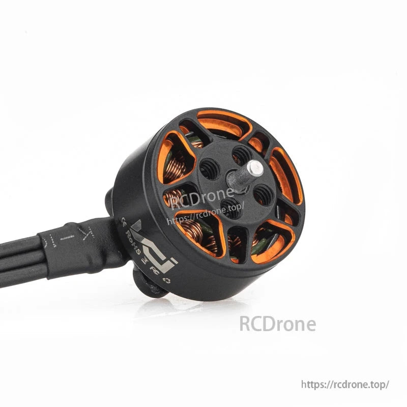 VCI SPARK 1104 FPV brushless motor angled view showing rotor vents, center shaft, and wiring exit