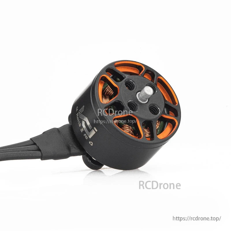 Angled view of VCI SPARK 1105 brushless motor showing shaft, orange cutouts, and wire exit