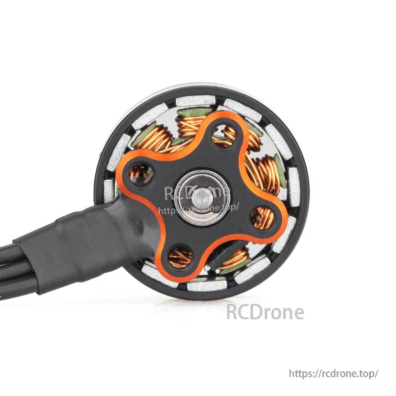 Bottom view of brushless motor showing mounting base pattern, center bearing, and wire exit