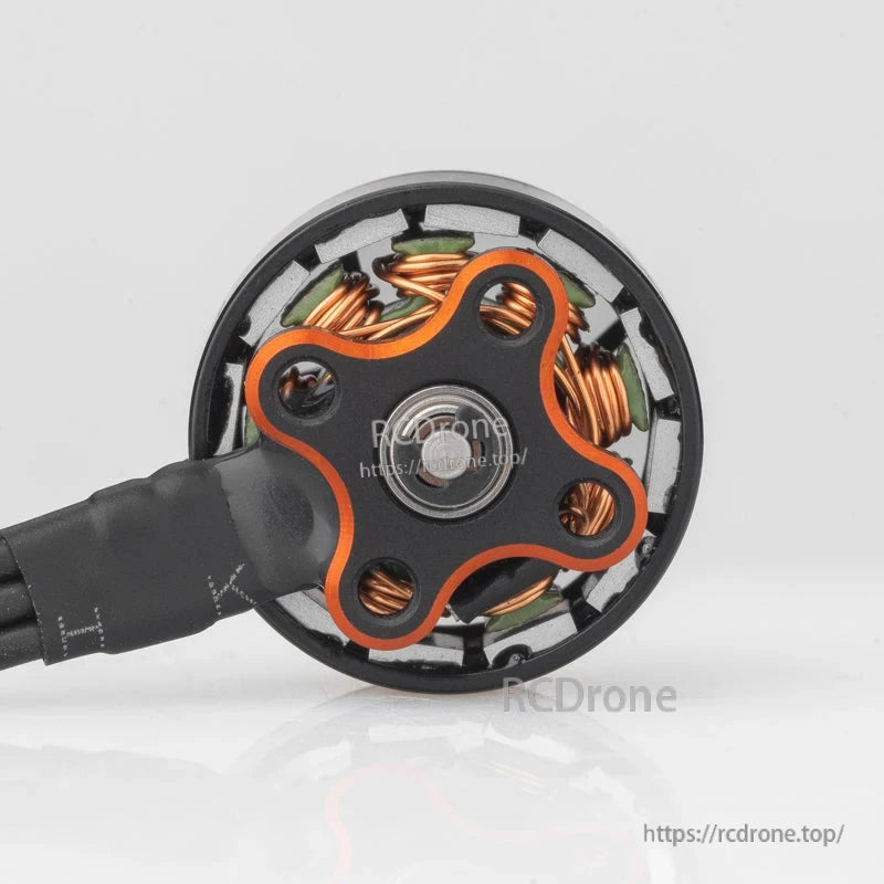 Bottom view of brushless motor showing mounting base plate, center bearing, and three screw holes