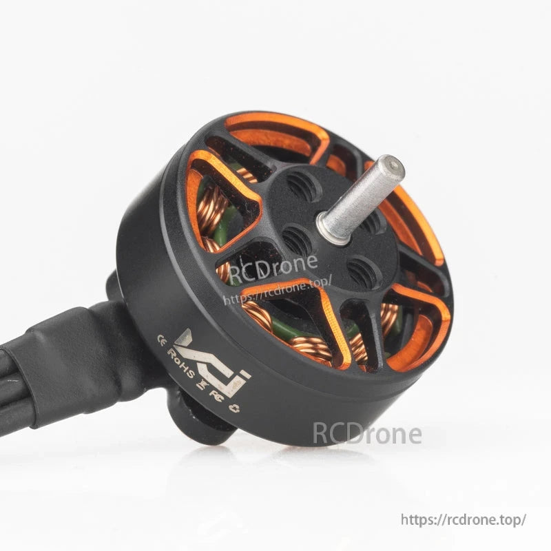 VCI SPARK 1203 brushless motor angled view with motor wires and printed compliance marks on the can