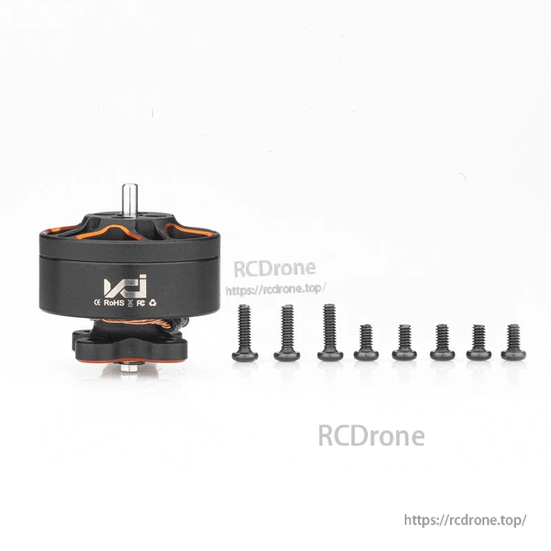 VCI SPARK 1304 brushless motor with included mounting screws laid out beside the motor