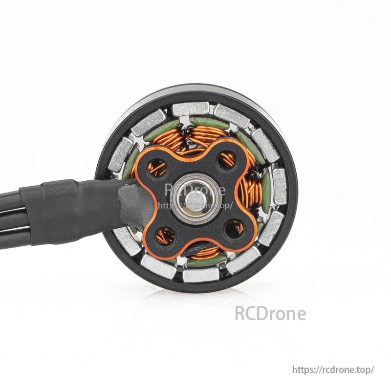 Bottom view showing stator windings, magnet ring, and center shaft of the motor