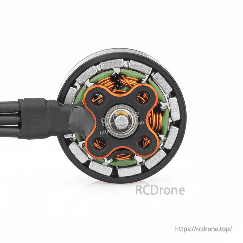 Bottom view of motor showing base plate, copper windings, and magnet ring inside the stator