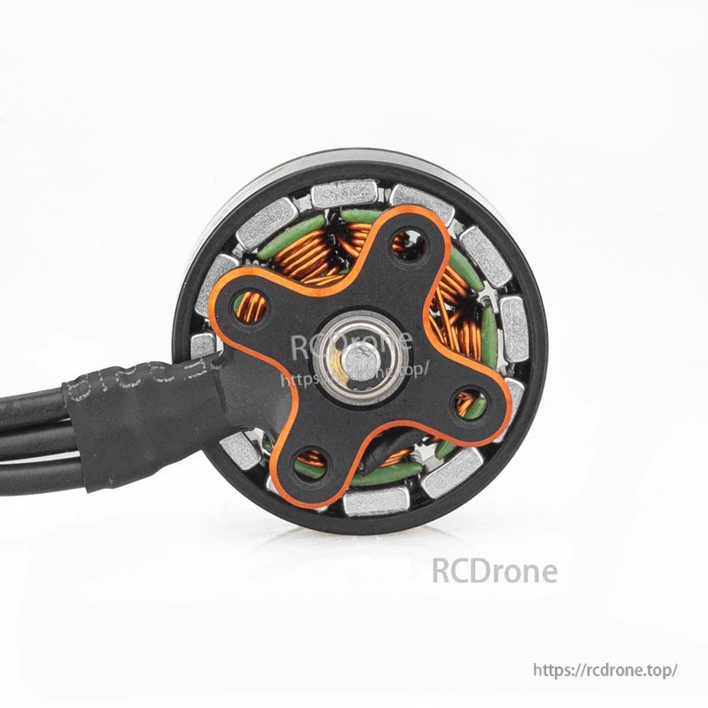 Bottom view showing motor base, bearing hub, and internal windings around the perimeter