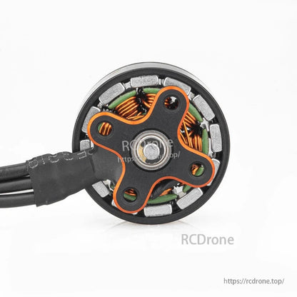 Bottom view showing motor base, bearing hub, and internal windings around the perimeter