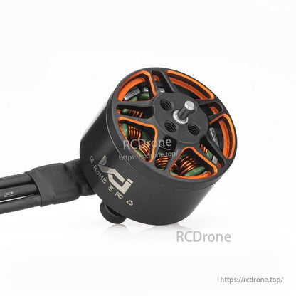 VCI SPARK 1407 brushless motor angled view showing rotor vents, shaft, and side markings
