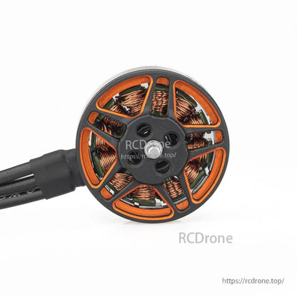 Top-down close-up of SPARK 1503 motor bell showing orange frame cutouts and copper windings