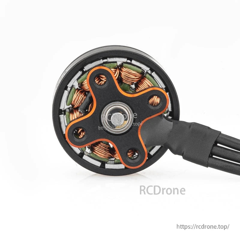 Bottom view showing motor base, bearing, and exposed copper windings with lead wires