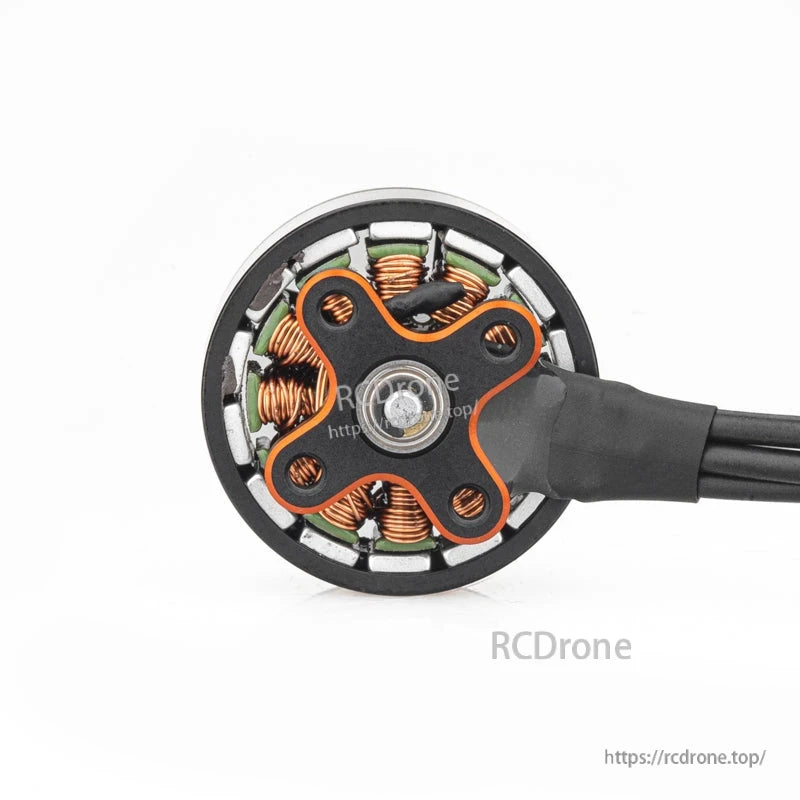 Bottom view of motor base showing four-hole mounting pattern and exposed copper windings