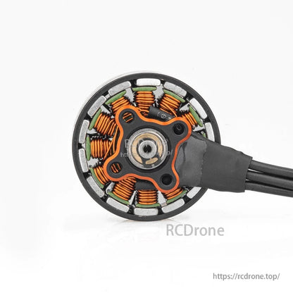 Top view of motor internals with copper windings and mounting plate on brushless motor