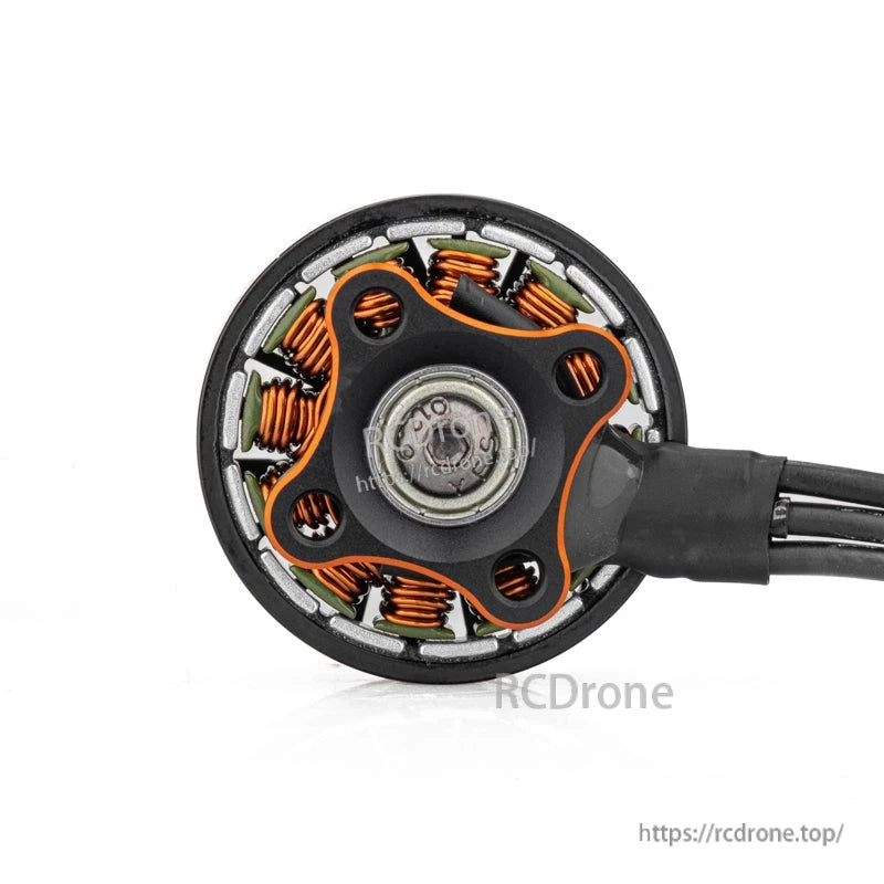 Bottom view of motor showing stator windings, base plate, and wire exit point