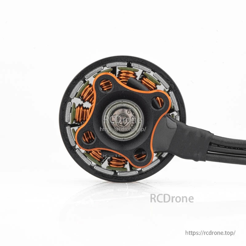Bottom view showing motor base, stator windings, and wire exit point for the brushless motor