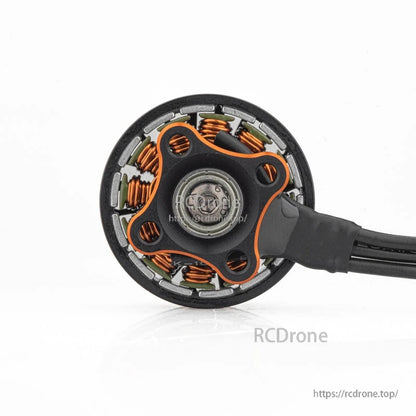 Bottom view showing motor base, stator windings, and wire exit point for the brushless motor