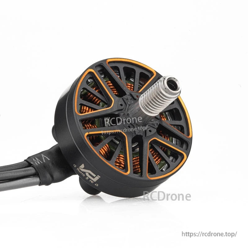 Angled view of VCI SPARK 2204 brushless motor showing threaded shaft, open bell, and lead wires