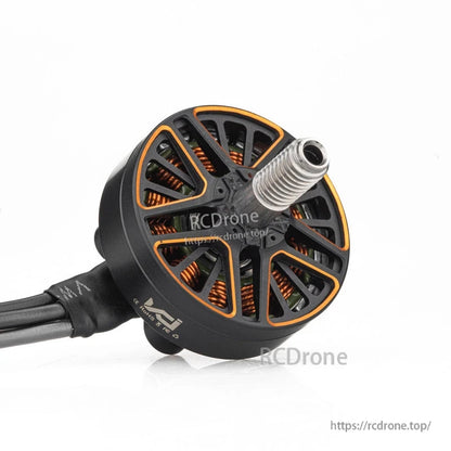Angled view of VCI SPARK 2204 brushless motor showing threaded shaft, open bell, and lead wires