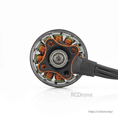 Bottom view of motor base with mounting pattern and exposed copper windings around the stator