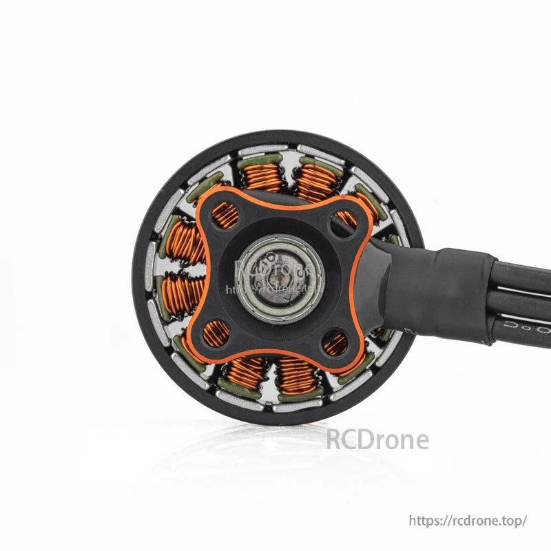 Bottom view showing 4-hole mounting base, bearing center, and exposed copper stator windings