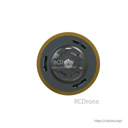 Top-down view of FPV drone motor bell with gold rim and vent slots around the cap