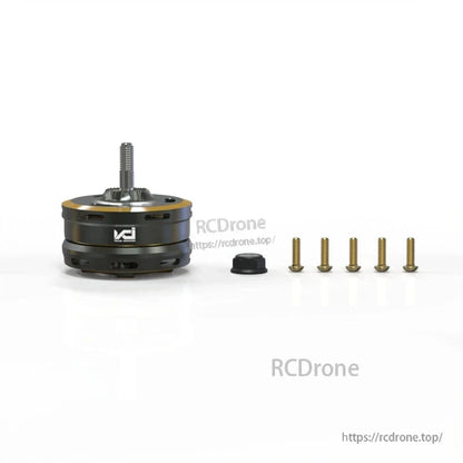 Motor with included hardware set, showing mounting screws and a small black cap/adapter beside unit