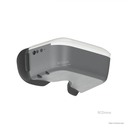 Side underside view of goggles showing button controls and lower nose contour on the housing