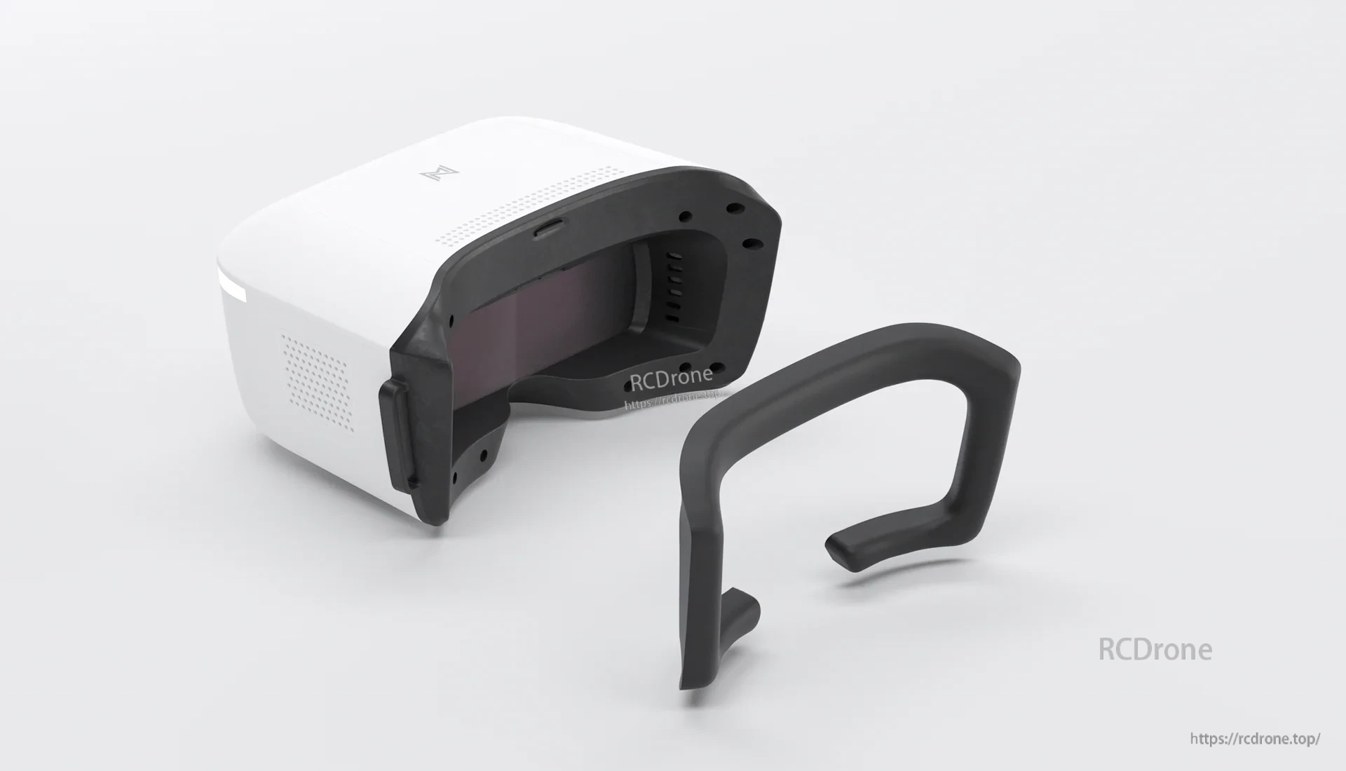 Goggles with detachable foam face mask removed and placed beside the headset for fit and comfort