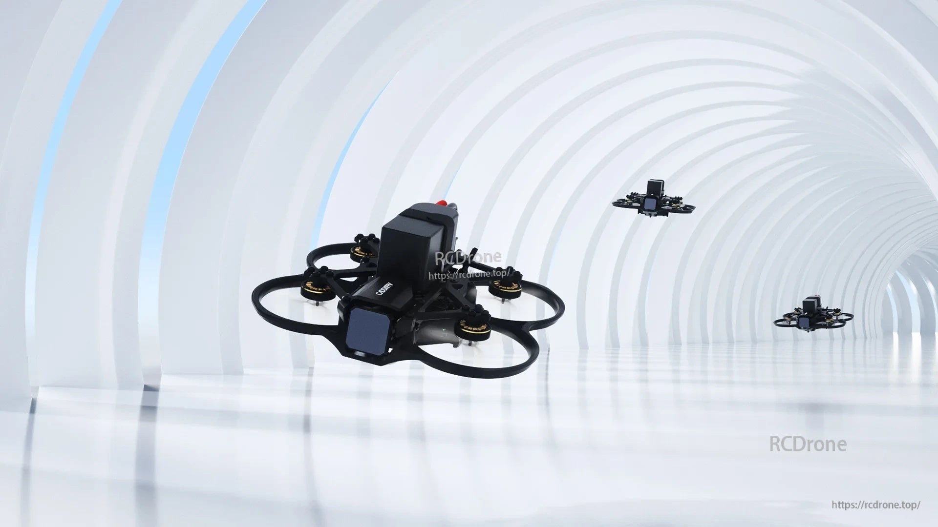 Compact ducted FPV quadcopter (cinewhoop) with front camera and four motors on a white background