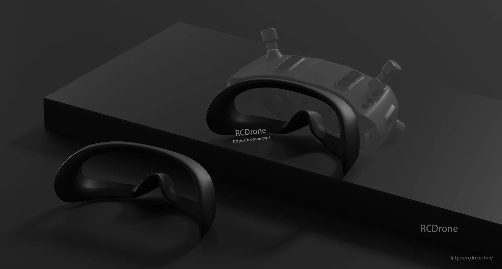 Two replacement foam face interfaces placed beside the goggles for fit and comfort options