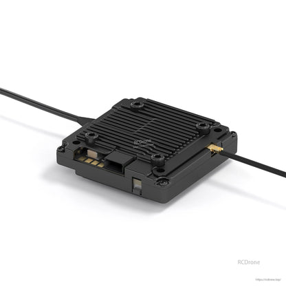 Video transmitter module close-up with finned heatsink housing and antenna connector