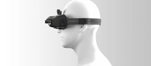 FPV goggles worn on head mannequin with compact front-mounted camera module