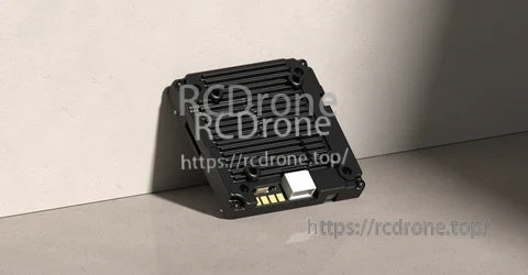 Walksnail Avatar V2 VTX module top view with heat-sink fins and onboard connector ports