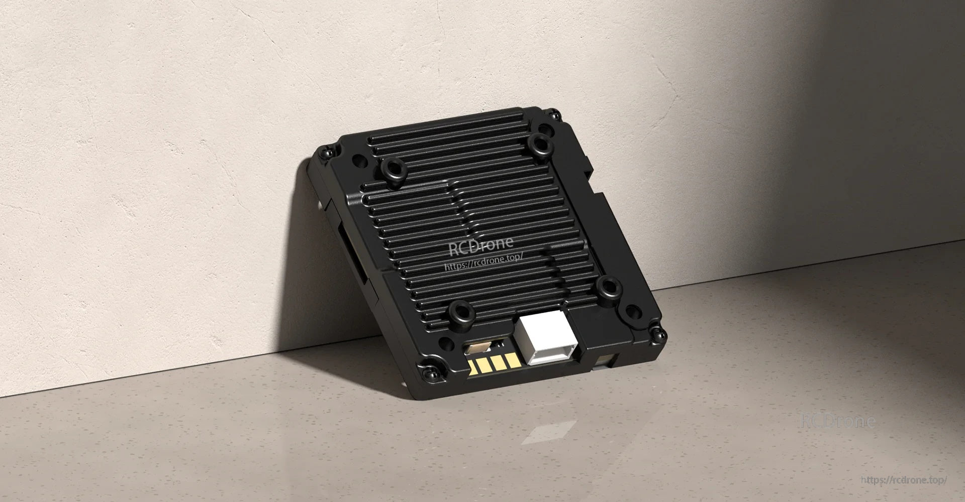 Walksnail Avatar V2 VTX module close-up showing finned heat-sink case and mounting holes