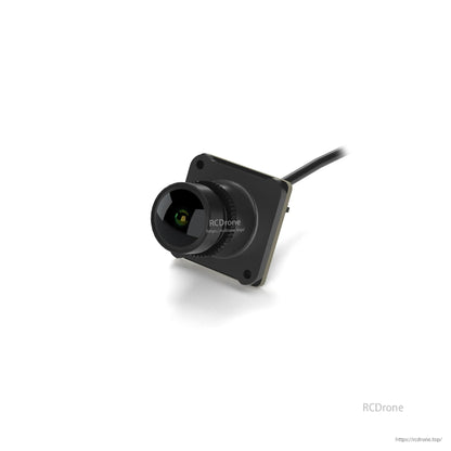 Angled view of mini FPV camera module with square mounting plate, lens barrel and rear cable