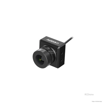 Top-angled view of black FPV camera with logo on housing, lens and mounting holes visible