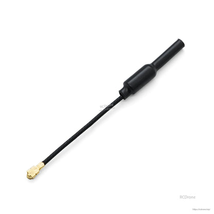 Close-up of the black antenna body and coax lead with gold micro RF connector on white background
