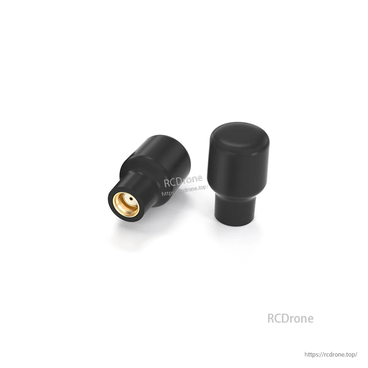 Close-up of black stubby goggles antennas showing the gold RF connector on one antenna