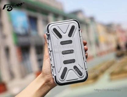 Compact waterproof FPV tool box with rugged gray lid, black seal edge, and side latches in hand