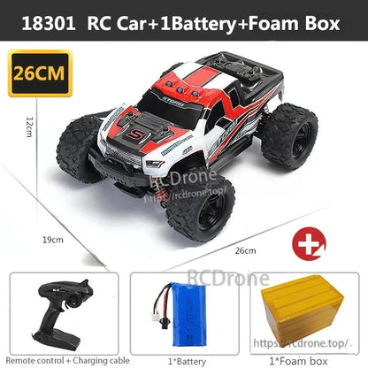Wltoys HS 18311/18312 1:18 4WD RC Car, 18301 RC car, 26cm long, includes remote, battery, charging cable, and foam packaging for protection.