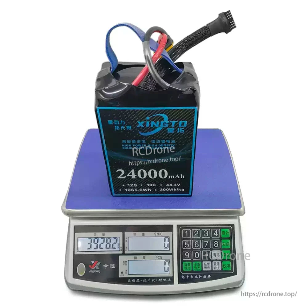 XINGTO 12S 24000mAh 44.4V solid-state lithium battery, 300Wh/kg energy density, weighs 3982g, designed for heavy-lift UAV drones. (24 words)
