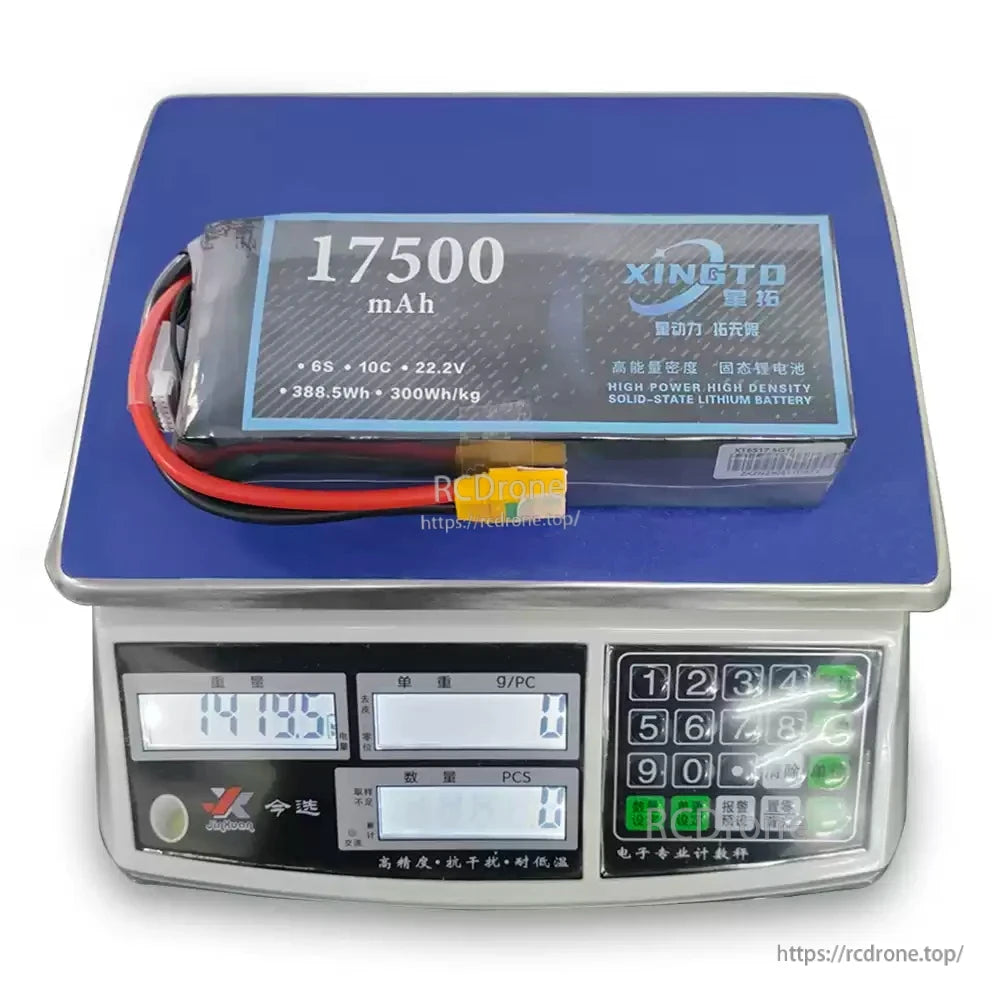 XINGTO 17500mAh 6S 10C 22.2V solid-state lithium battery, 388.5Wh, 300Wh/kg, weighs 1419.5g on digital scale.