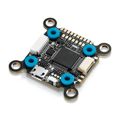 Hobbywing XRotor F7 flight controller board with USB-C port, JST plugs, and four soft-mounted grommet holes