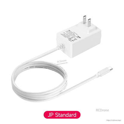 JP plug version power adapter with attached USB-C cable, angled view on white background