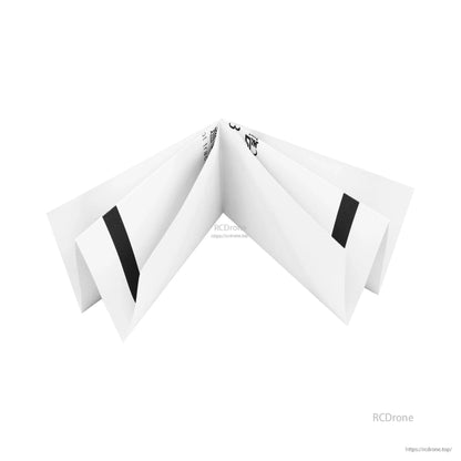 Folded paper tracking map showing crease folds and sections of the black line track for storage