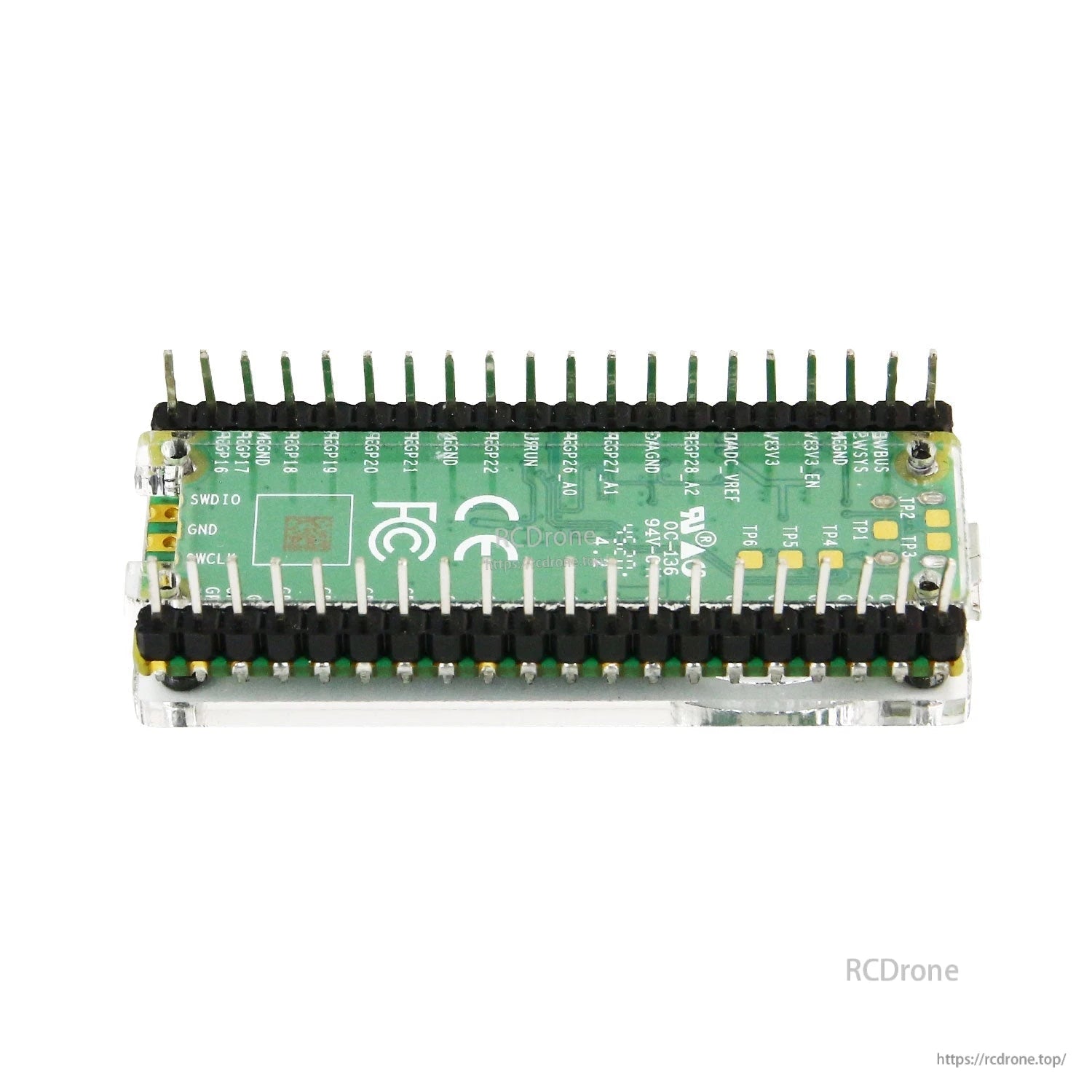 Rear view of board in acrylic case showing pin header rows and underside visibility through clear panels