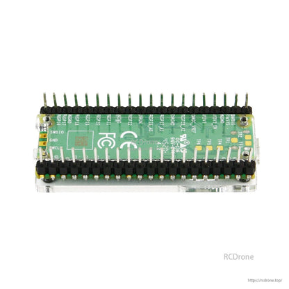 Rear view of board in acrylic case showing pin header rows and underside visibility through clear panels
