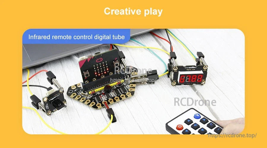 Creative project setup using the 4-digit digital tube with micro:bit and an IR remote control on a desk